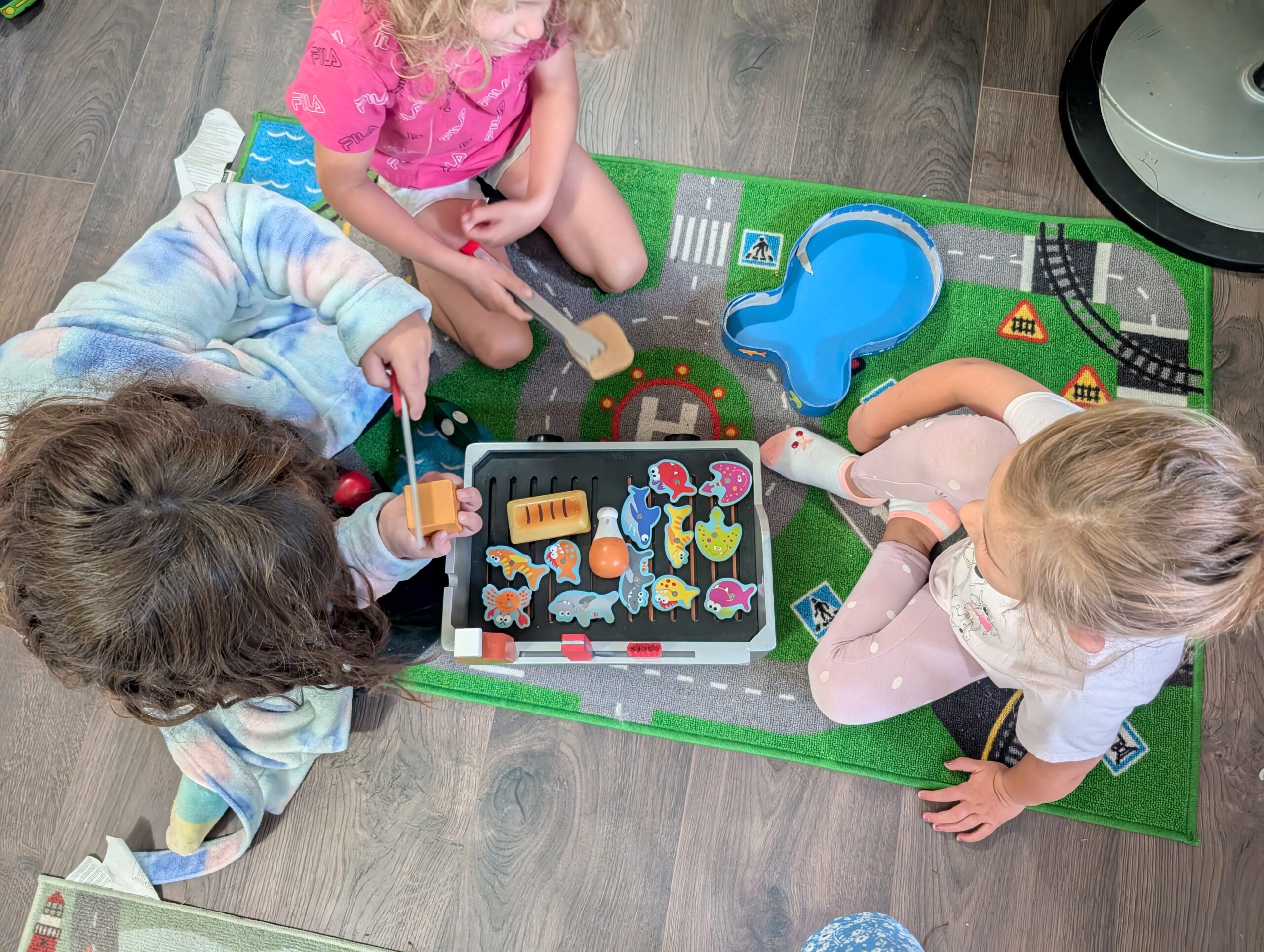 Three children pretending to cook food